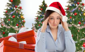 Stressed woman shopping for gifts of christmas with red santa hat looking angry and distressed