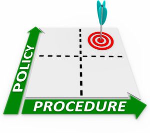 Policies and Procedures must be enforced. Policy and Procedure words on a matrix to illustrate a company's practices being in line with its rules and regulations
