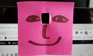 USe a sticky note to create a face for your computer camera so you'll look at it, not your monitor, during an interview.